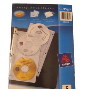 May include: A blue and white package of Avery CD pages. The package shows a close-up of the CD pages with CDs inside. The package says "Avery Advantages" and "CD Pages" and "Each page holds 4 CDs". The package also says "5 Pack".