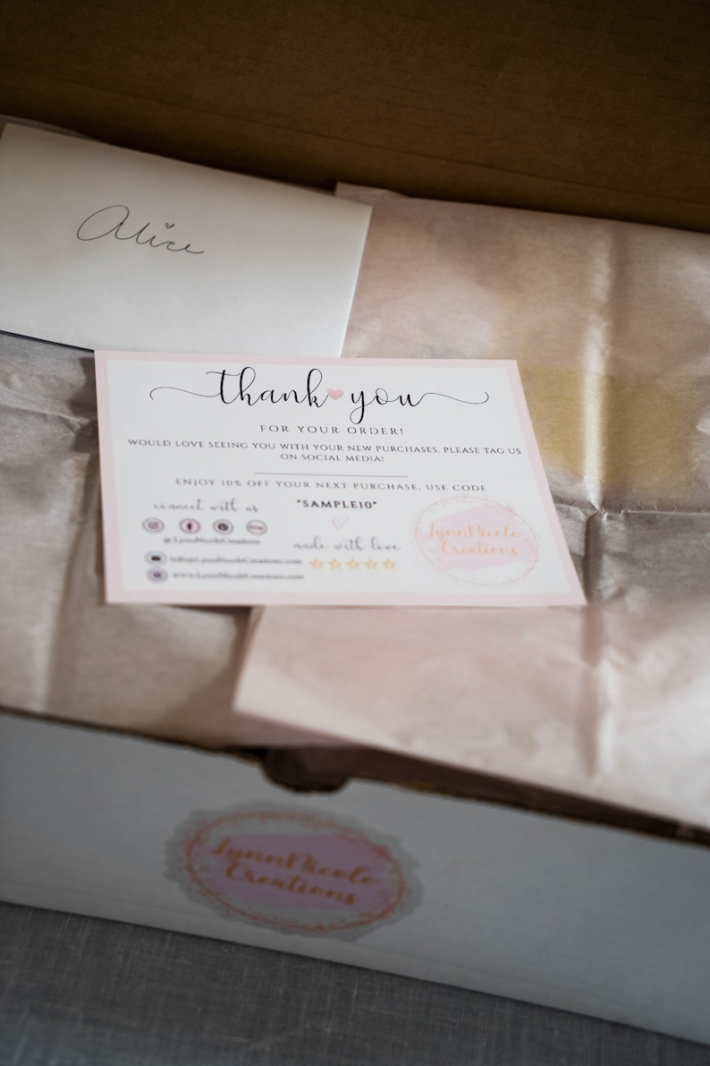May include: A rectangular thank you card with a light pink border, featuring the text thank you for your order, social media icons, a discount code SAMPLE10, and the brand name LynnNicole Creations, placed inside a cardboard box with tissue paper.