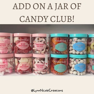 May include: Twelve clear plastic jars of Candy Club sweets arranged in two rows. The text reads ADD ON A JAR OF CANDY CLUB! and @LynnNicoleCreations. Varieties include Strawberries 'N Creme Taffy, Be My Sweetheart, Sweetheart Pretzels, Peach Hearts, Celebration Bites, and Lemonade Rings.