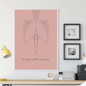 May include: A pink poster with a line drawing of a single scull rowing boat with a person in it. The text "Rowing: A sport for dreamers" is at the bottom of the poster.