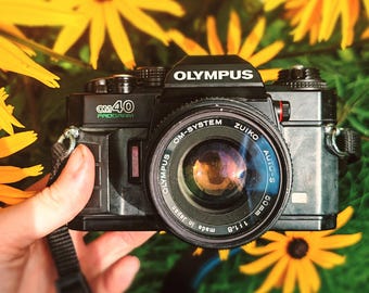 Olympus OM-2 35mm Film Camera W/ 50mm F1.8 Zuiko Lens – Vintage