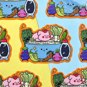 May include: A repeating pattern of stickers featuring a blue bowl of ramen with a smiling pig, vegetables, and soy sauce. The stickers have a cartoon style with bright colors and a playful design, set against yellow and blue backgrounds.