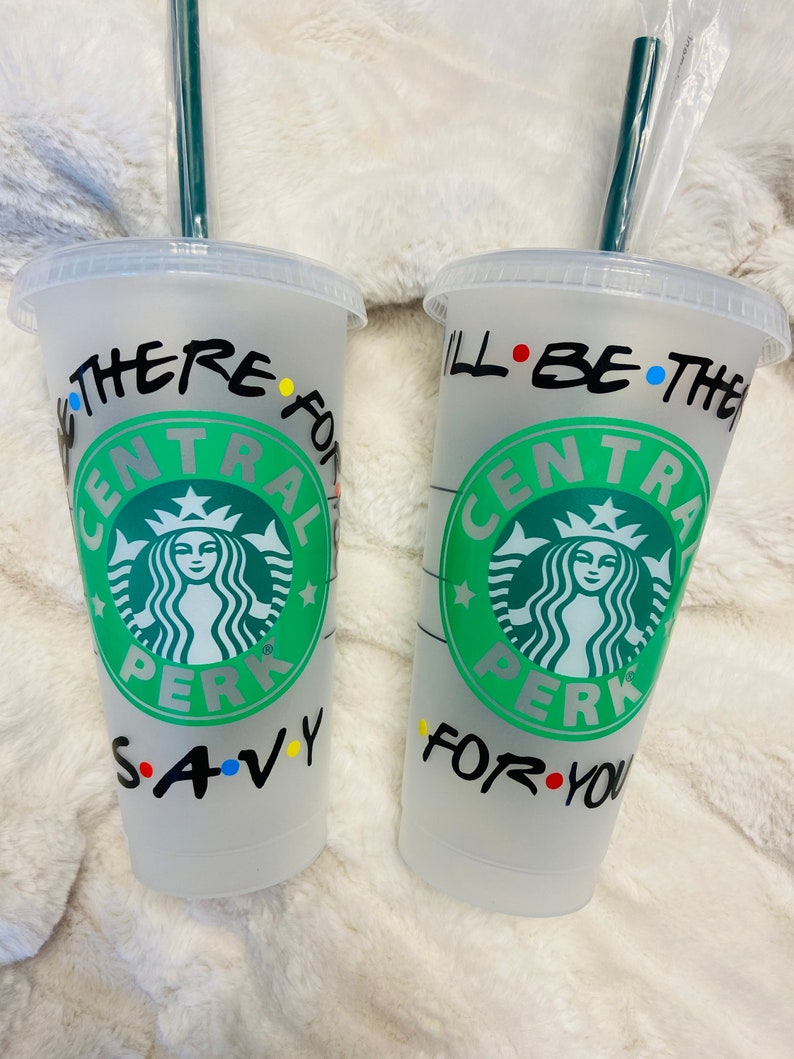May include: Two clear plastic cups with black writing and a green Starbucks logo. The text on the cups reads "I'll be there for you" and "We were on a break".