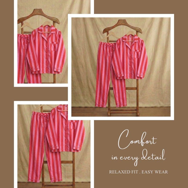 May include: A pink and red striped pyjama set, comprising a button-down shirt with a chest pocket and matching trousers. The set is displayed on a wooden hanger and a small wooden ladder. The text reads "Comfort in every detail. Relaxed fit. Easy wear."