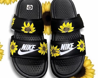 white sunflower nike slides