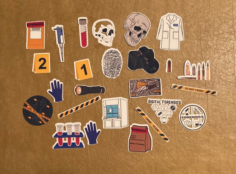 May include: A collection of crime scene investigation stickers featuring various elements such as a skull, a lab coat, a fingerprint, a camera, crime scene tape, a test tube, a flashlight, and an evidence bag. The stickers are on a brown surface.