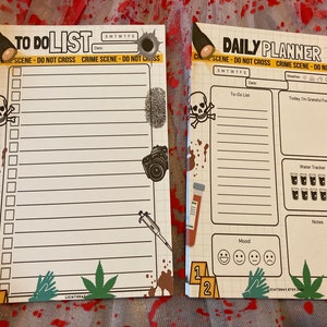 May include: Two crime scene-themed notepads. One is a to-do list, the other a daily planner. Both have a grid background, bullet holes, and crime scene tape. The to-do list has a skull and crossbones, a camera, and a syringe. The daily planner includes a water tracker.