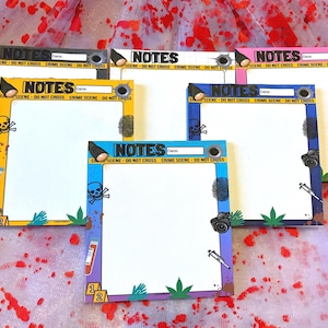 May include: A collection of crime scene-themed notepads with various colored borders. Each notepad features the word "NOTES", a space for the date, and the text "CRIME SCENE - DO NOT CROSS". The borders are decorated with crime scene elements.