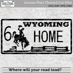 May include: Black and white Wyoming license plate design with the text "WYOMING HOME" and a bucking bronco silhouette. The number "6" is on the left. The design includes the text "License Plate Themed Cut Files" and the question "Where will your road lead?"