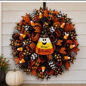 May include: A Halloween wreath with orange, black, and white ribbons, candy corn accents, and a candy corn-shaped sign that says "Happy Halloween." The wreath is decorated with a variety of patterns and textures.