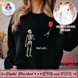 May include: A black long-sleeve sweatshirt featuring a graphic of a skeleton standing with its arm detached, holding a red balloon by a string. The text "Well, shit..." is printed in white below the skeleton. A circular inset shows the same design.
