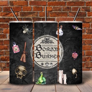 May include: A set of three black tumblers with a spooky theme. Each tumbler features a different design, including a spider, potion bottles, a skull, and the text "Borgin and Burkes". The tumblers have a black straw.