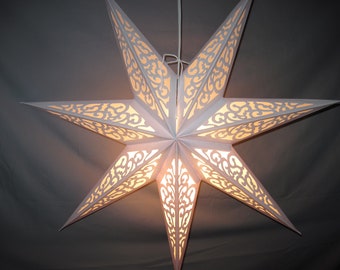 May include: A white paper star lantern with a delicate, intricate cut-out design. The lantern is illuminated from within, casting a warm glow.