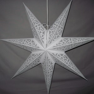 May include: A white, eight-pointed star-shaped paper lantern. The star has intricate cut-out patterns along each point, and is suspended by a white cord. The lantern is designed for decorative lighting.