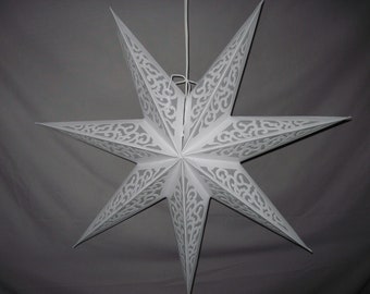 May include: A white, eight-pointed star-shaped paper lantern. The star has intricate cut-out patterns along each point, and is suspended by a white cord. The lantern is designed for decorative lighting.
