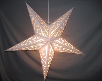 May include: A white paper star lantern with a delicate, intricate cut-out design. The lantern is illuminated from within, casting a warm glow.