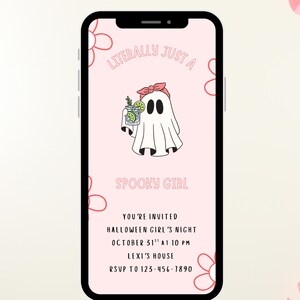 May include: A smartphone displays a pink Halloween invitation with a ghost illustration and the text "Literally Just A Spooky Girl." The image includes a pink pumpkin with eyelashes, paper decorations, and straws.