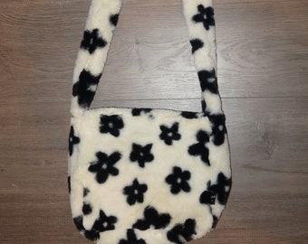 fluffy white bag with black flowers