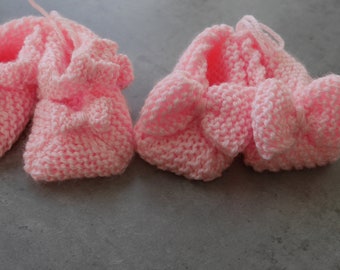 Hand knitted newborn baby girls booties  with bow detail