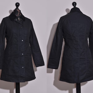 Chaqueta impermeable con cremallera completa encerada negra Belsay de Barbour para mujer, talla UK8 US4