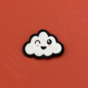 May include: A white cloud with a black outline and a happy face. The cloud is winking and has pink cheeks.