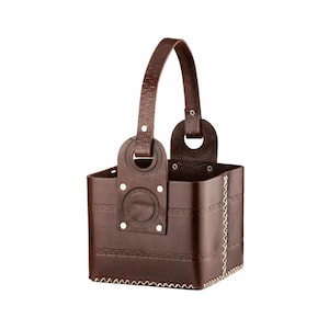 May include: A brown leather tote bag with a square base and a single handle. The bag has decorative stitching and metal accents.