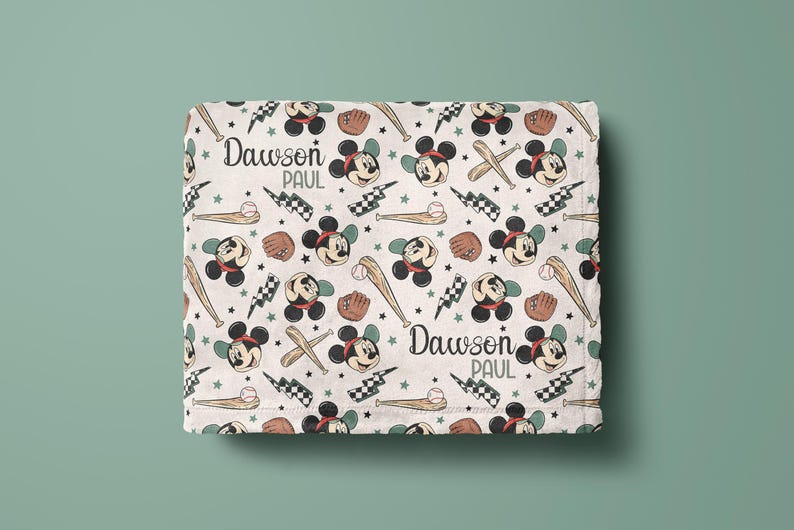 May include: White baby blanket with a repeating pattern of Mickey Mouse heads, baseball bats, and baseballs. The blanket has the names "Dawson Paul" printed on it.