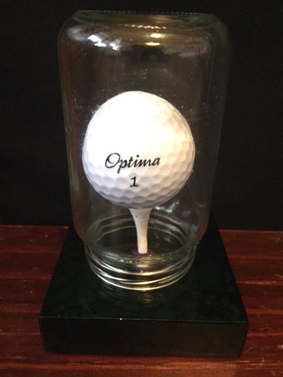A Standard Size Golf Ball Iin a Jar With an Opening Smaller Etsy