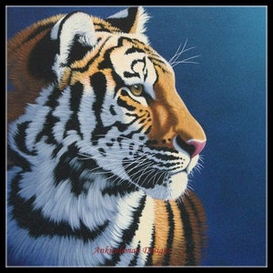 May include: A close-up of a tiger's face, with its head turned to the side. The tiger has orange and black stripes, and its eyes are a bright green. The background is a dark blue.