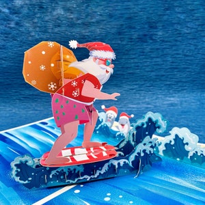 Brave les vents et les vagues, carte pop-up 3D, carte de Noël 3D, père Noël rigolo, carte de Noël rigolote, pop-out surprise