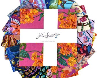 May include: A collection of fabric squares in various floral and patterned designs, arranged in a circular shape. The fabrics feature vibrant colors like pink, orange, blue, and purple. A white cross shape in the center displays the "Free Spirit" logo.