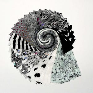 May include: A spiral arrangement of fabric swatches in various black and white patterns. Designs include stripes, polka dots, floral, geometric, and abstract shapes. The fabrics are fanned out, creating a dynamic, eye-catching display.