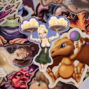 May include: A sticker featuring a cartoon woman wearing a green dress and carrying a tray of beer mugs. The sticker is surrounded by other stickers, including a dragon, a frog, and a woman with brown hair.