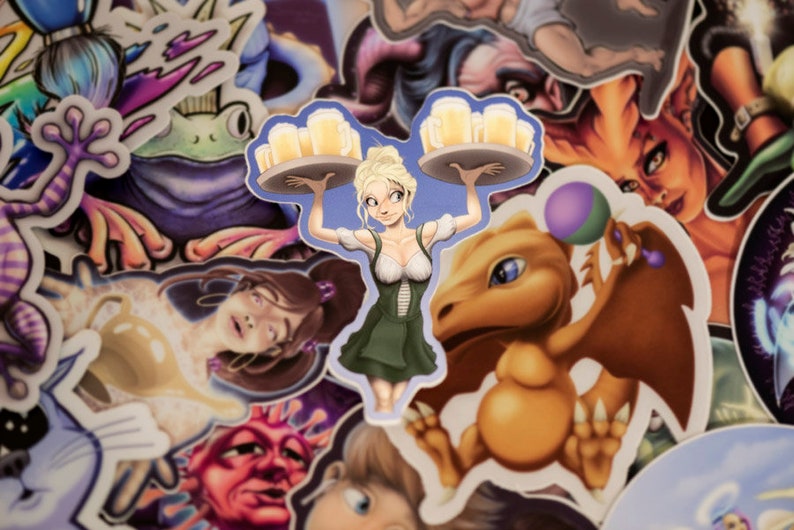 May include: A sticker featuring a cartoon woman wearing a green dress and carrying a tray of beer mugs. The sticker is surrounded by other stickers, including a dragon, a frog, and a woman with brown hair.