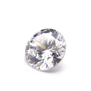 May include: A clear, round, faceted diamond gemstone.