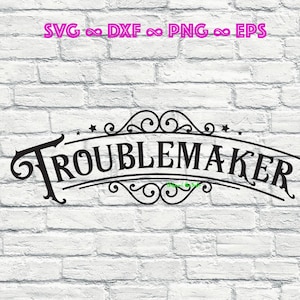 May include: Black graphic design on a white brick wall. The design features the word "TROUBLEMAKER" in a decorative font, arched above and below with ornate flourishes and stars. Above the text are the words "SVG ∞ DXF ∞ PNG ∞ EPS" in pink.