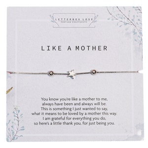 A silver bracelet with a central star charm and two small spherical beads presented on a card with the title 'LIKE A MOTHER' in bold letters. Below the bracelet, a heartfelt poem expresses gratitude and love to a motherly figure.