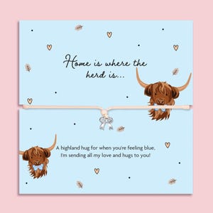 May include: A light blue card with the text "Home is where the herd is..." and "A highland hug for when you're feeling blue, I'm sending all my love and hugs to you!" features illustrations of Highland cows and hearts.