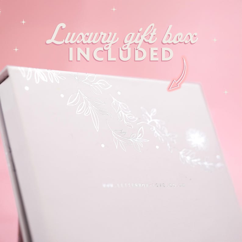 May include: A white gift box with a floral design and the text "Luxury gift box INCLUDED".