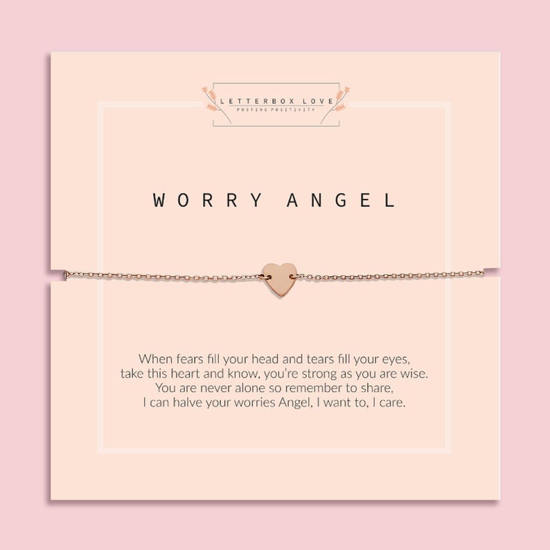Delicate gold chain bracelet with a small heart charm displayed on a pale peach card. The card reads 'Worry Angel' at the top, with a poem below: 'When fears fill your head and tears fill your eyes, take this heart and know, you’re strong as you are wise. You are never alone so remember to share, I can halve your worries Angel, I want to, I care.' The brand name 'Letterbox Love' appears at the top with the tagline 'Posting Positivity'.