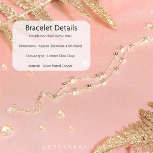 May include: A silver-plated copper bracelet with a double box chain design. The bracelet features six star charms and measures approximately 20cm (including a 4cm chain). It has a lobster claw clasp.