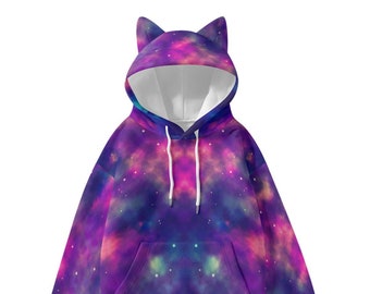 May include: A galaxy-print hoodie in purple, pink, and blue hues. The sweatshirt has a hood with cat ears and a front pocket. White drawstrings are present at the neckline.