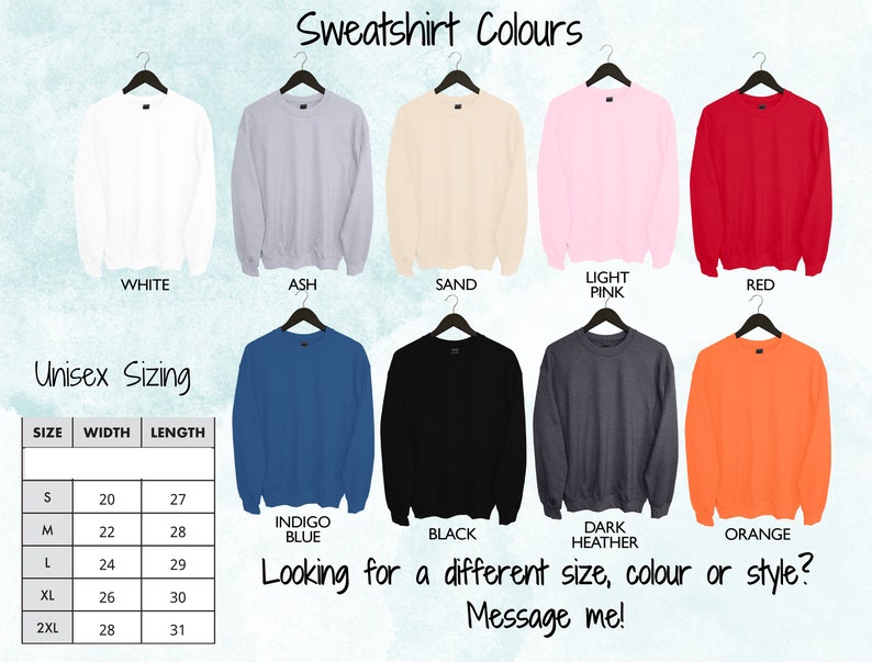 May include: A chart showing sweatshirt colors and unisex sizing. The colors are white, ash, sand, light pink, red, indigo blue, black, dark heather, and orange. The sizing chart shows sizes S, M, L, XL, and 2XL with corresponding width and length measurements in inches.