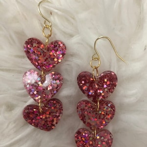 Dangly pink glitter hearts earrings