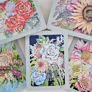 May include: Five different floral greeting cards with watercolor illustrations of various flowers. The cards are all on a white background and have a light blue border.
