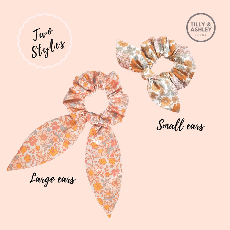 May include: Two floral print scrunchies with different sized bows. The scrunchie on the left has large bows and the scrunchie on the right has small bows. The text "Two Styles" is in a circle at the top of the image. The text "Large ears" is below the scrunchie on the left and the text "Small ears" is below the scrunchie on the right.