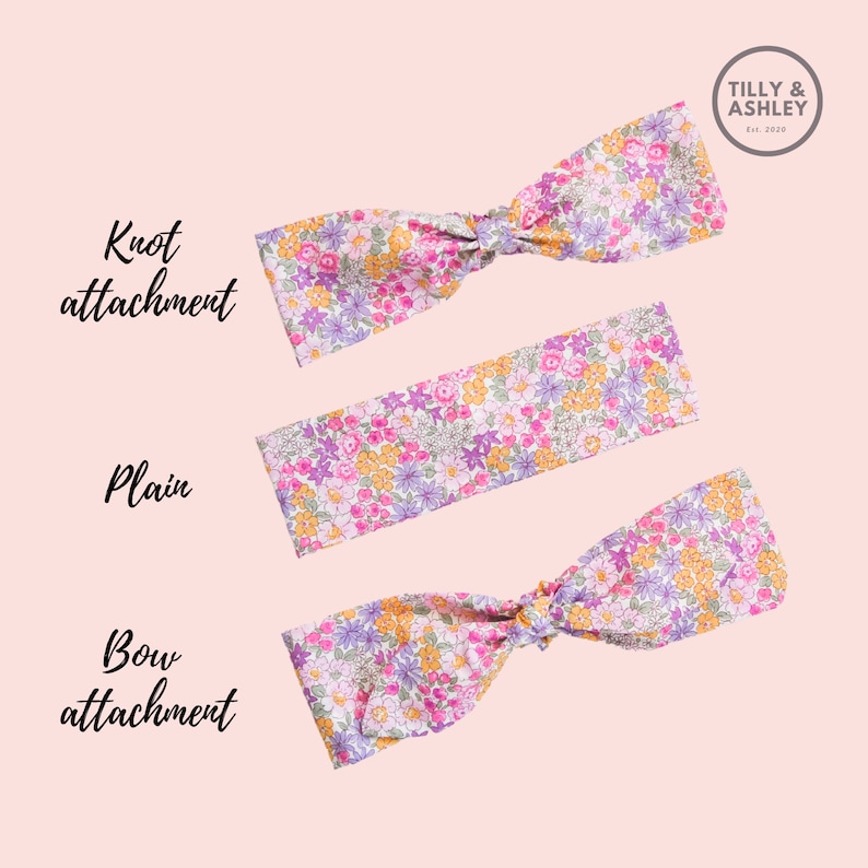 Puede incluir: Tres diademas de estampado floral con diferentes estilos de sujeci&oacute;n: nudo, liso y lazo. Las diademas son todas rosas con flores moradas, amarillas y blancas.