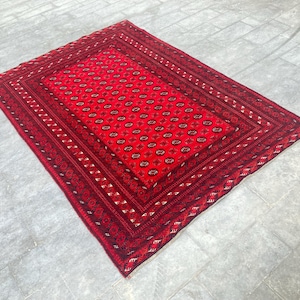Handmade Wool Afghan Rug: 6.6 x 9.3 ft, Red Oushak Vintage Rug