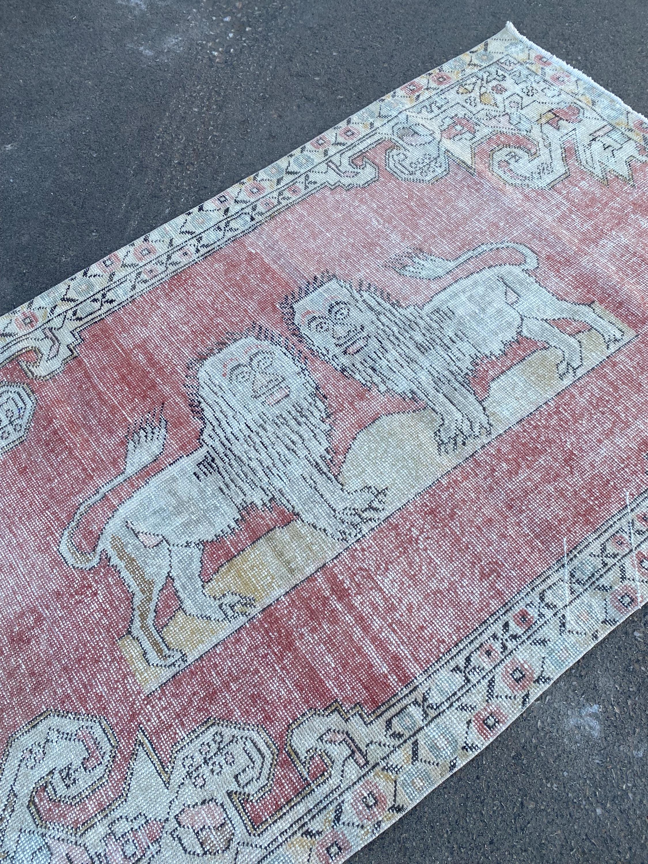 Vintage Lion Motif Turkish Rug: Handmade Wool Accent Rug (4.4x7.4