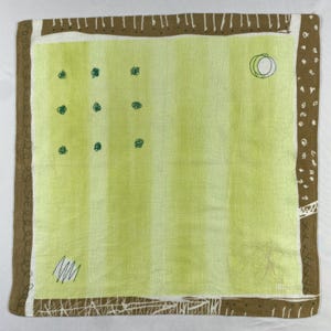 May include: Square, pale green scarf with a striped design. The scarf has a brown border with white detailing and a white inner border. It features dark green dots, a circle, and abstract line drawings.